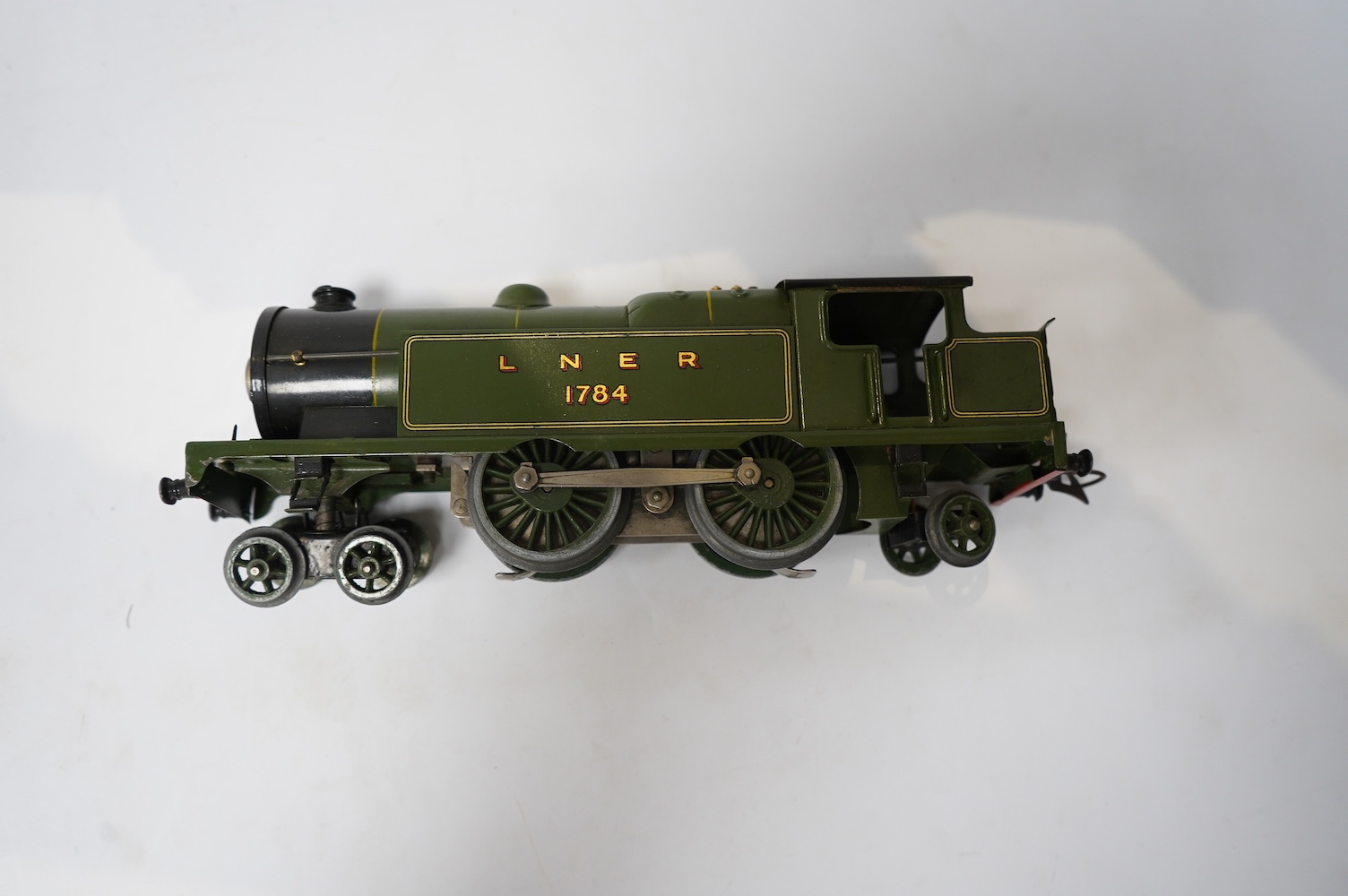 Twenty-four HO gauge model railway by Lima, Trix, Fleischmann, etc. including a German DB 4-6-2 tender locomotive, 10 001, fourteen Continental outline bogie coaches, 4-wheel coaches, and freight wagons. Condition - fair